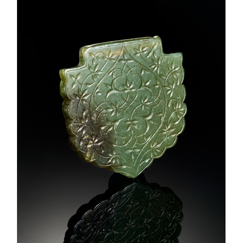 117 - A LARGE TIMURID ENGRAVED JADE PENDANT DEPICTING FLORAL DESGIN, 14TH - 15TH CENTURY  A large jade pen... 