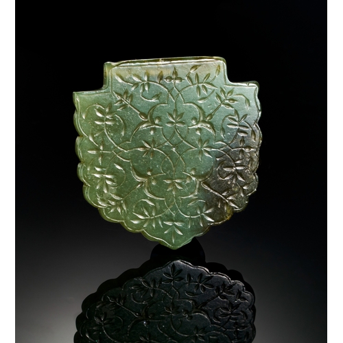 117 - A LARGE TIMURID ENGRAVED JADE PENDANT DEPICTING FLORAL DESGIN, 14TH - 15TH CENTURY  A large jade pen... 