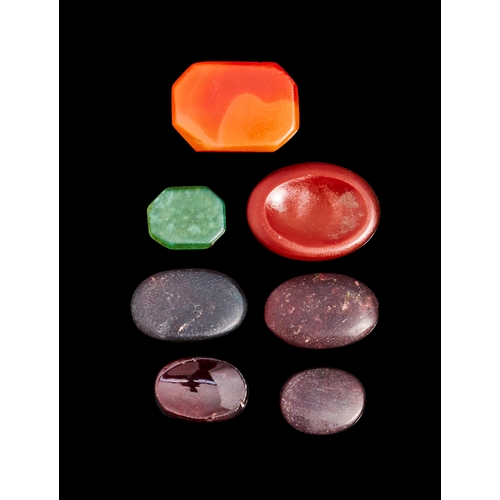 125 - A COLLECTION OF AGATE, GARNET AND JADE KUFIC ENGRAVED SEALS, 12TH - 14TH CENTURY  A set of six exqui... 