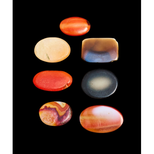 128 - A GROUP OF KUFIC SCRIPT BANDED AGATE SEALS, 12TH - 14TH CENTURY  This collection features six finely... 