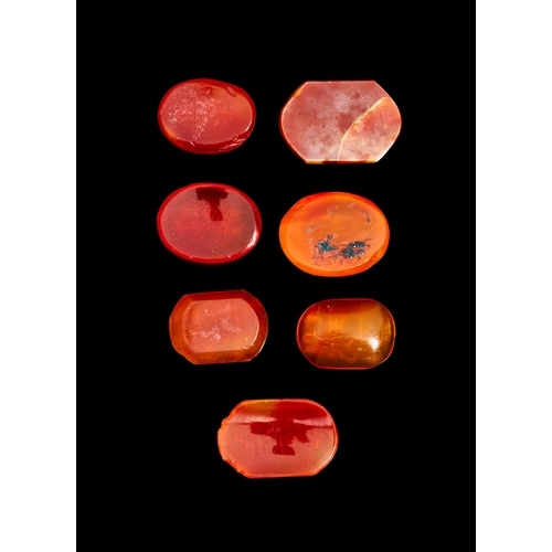 130 - A GROUP OF SEVEN EARLY ISLAMIC ENGRAVED AGATE SEALS WITH KUFIC SCRIPT, 9TH - 12TH CENTURY  A GROUP O... 