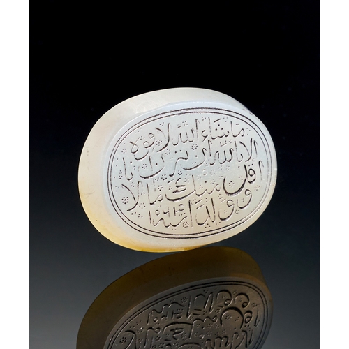 144 - AN INSCRIBED ISLAMIC WHITE AGATE RING STONE, 19TH CENTURY  AN INSCRIBED ISLAMIC WHITE AGATE RING STO... 