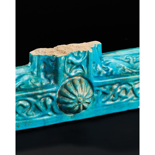 150 - A KASHAN TURQUOISE GLAZED POTTERY BORDER TILE, 12TH-13TH CENTURY  A turquoise-glazed pottery border ... 