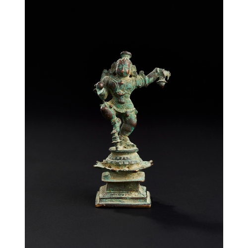 175 - A 17TH CENTURY OR EARLIER SOUTH INDIAN BRONZE FIGURE OF DANCING KRISHNA A 17TH CENTURY OR EARLIER SO... 