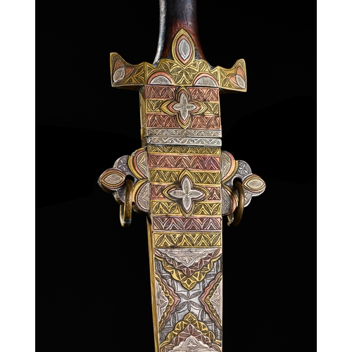 194 - A LARGE NORTH AFRICAN TUAREG SILVER, COPPER AND BRASS INALID SWORD, 19TH CENTURY  A19th-century Nort... 