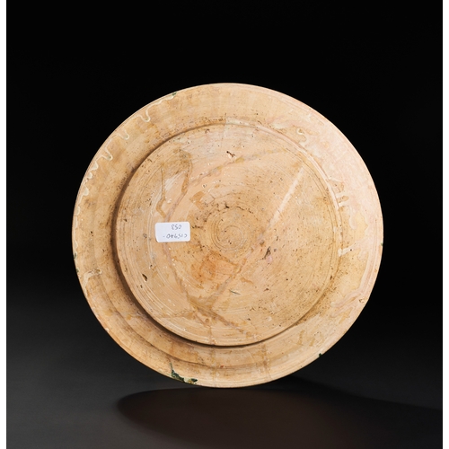 207 - A RARE ABBASID POTTERY CHARGER WITH KUFIC CALLIGRAPHY, MESOPOTAMIA, 10TH CENTURY  A RARE ABBASID POT... 