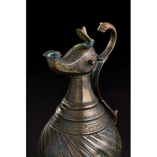 229 - A BRONZE SELJUK EWER, 13TH CENTURY  SELJUK BRONZE EWER, 13TH CENTURY  
 
H: 23.5cm ... 