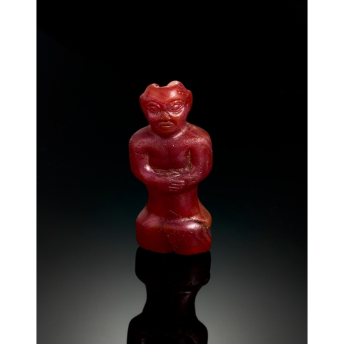 23 - CARNELIAN AGATE FIGURE OF WORSHIPPER OR ATTENDANT, MESOPOTAMIA, LATE 2ND CENTURY MILLENNIUM B.C. TO ... 