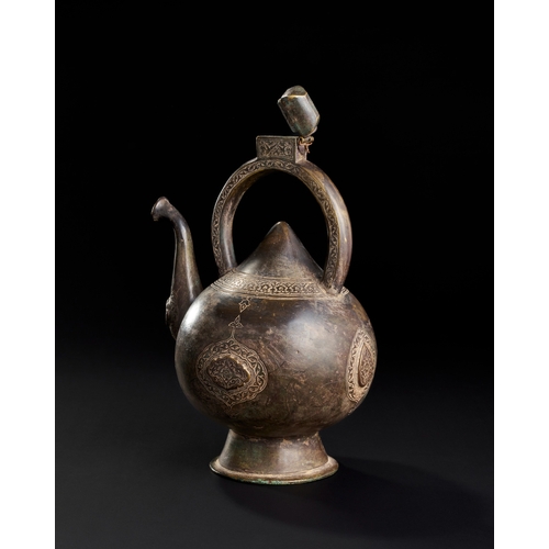 230 - A FINE ENGRAVED KETTLE SHAPED BRONZE EWER, SAFAVID, 17TH CENTURY  A17th-century Safavid bronze ewer ... 