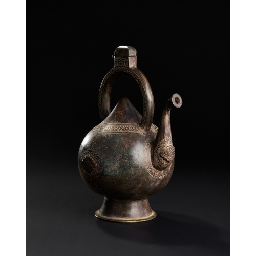 230 - A FINE ENGRAVED KETTLE SHAPED BRONZE EWER, SAFAVID, 17TH CENTURY  A17th-century Safavid bronze ewer ... 