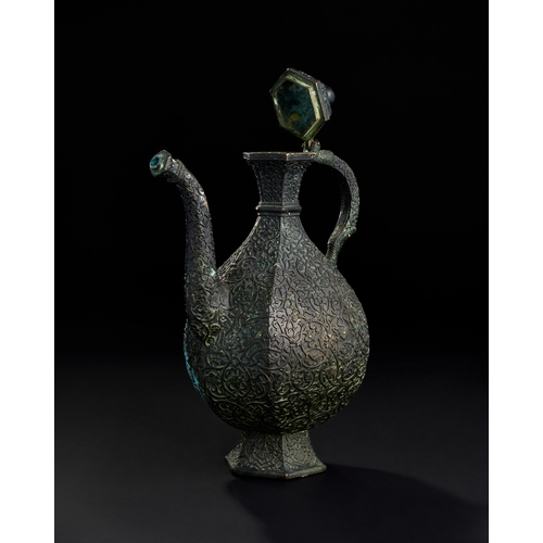 234 - AN ENGRAVED BRONZE MUGHAL INDIAN EWER, DECCAN, 19TH CENTURY  A 19th-century bronze ewer from the Dec... 