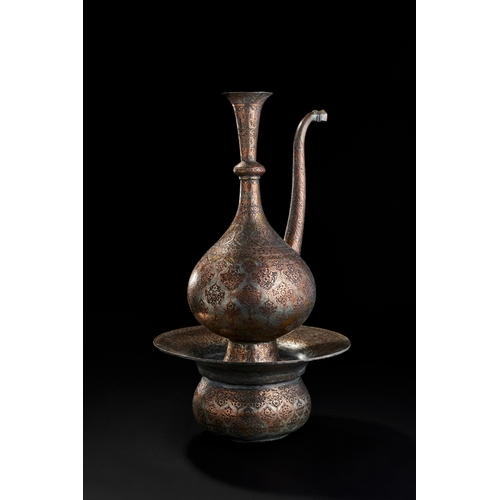 235 - AN ENGRAVED COPPER EWER AND BASIN,PERSIA, 19TH CENTURY A 19th-century Safavid Revival copper ewer an... 