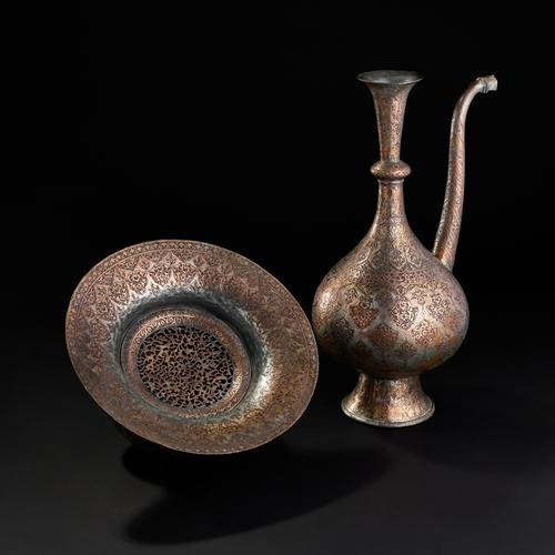 235 - AN ENGRAVED COPPER EWER AND BASIN,PERSIA, 19TH CENTURY A 19th-century Safavid Revival copper ewer an... 