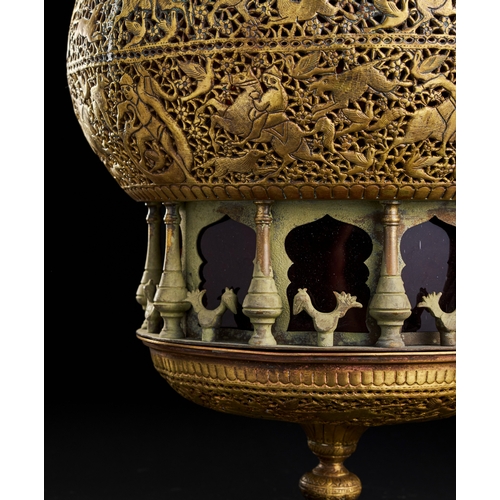 248 - AN ENGRAVED OPEDWORK QAJAR BRASS LAMP, 19TH CENRY  A19th-century brass lamp from the Qajar period, D... 