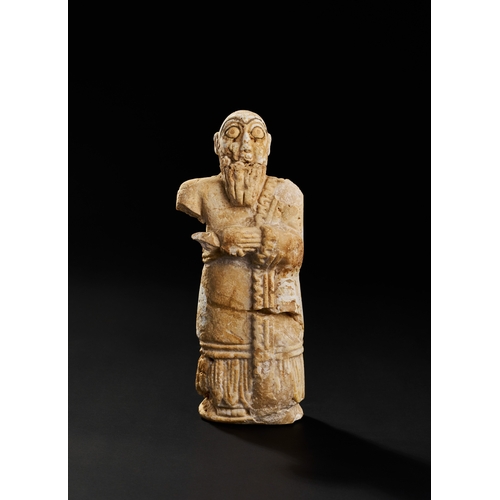 26 - ANCIENT SUMERIAN WHITE STONE STATUE, CIRCA 2500 B.C. A Sumerian white stone statue, dating to circa ... 