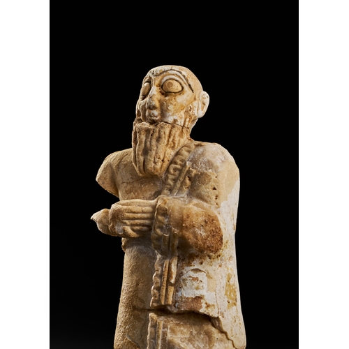 26 - ANCIENT SUMERIAN WHITE STONE STATUE, CIRCA 2500 B.C. A Sumerian white stone statue, dating to circa ... 