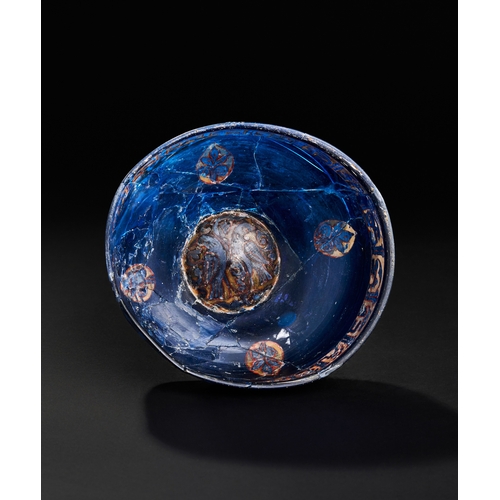 270 - A RARE MAMLUK ENAMELLED BLUE GLASS BOWL, 13TH -14TH CENTURY  A RARE MAMLUK ENAMELLED BLUE GLASS BOWL... 