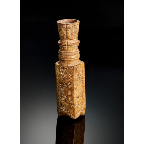 316 - A FATIMID ENGRAVED BONE PERFUM BOTTLE, EGYPT OR SYRIA, 10TH-11TH CENTURY of rectangular form on four... 