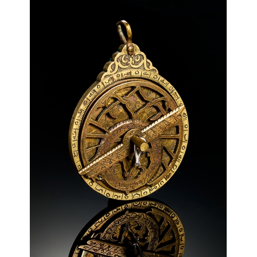 321 - A FINE ENGRAVED QAJAR BRASS MINIATURE ASTROLABE, 19TH CENTURY  A 19th-century brass miniature astrol... 