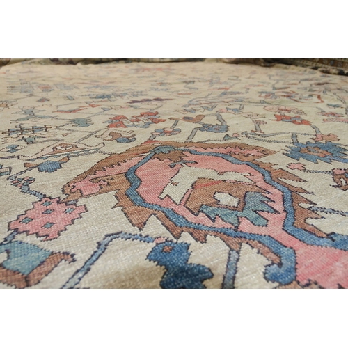 348 - A RARE AND LARGE ANTIQUE SERAPI RUG, 567 X 345cm A rare to find Serapi with the cream ground with an... 