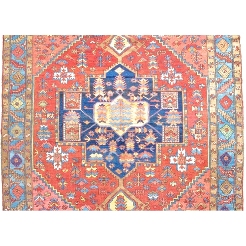 354 - ANTIQUE WOOL HERIZ KARAJA CARPET, 398 X 299 CM Terracotta ground colour has a wonderful harmony with... 