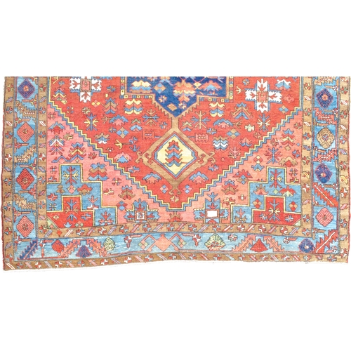 354 - ANTIQUE WOOL HERIZ KARAJA CARPET, 398 X 299 CM Terracotta ground colour has a wonderful harmony with... 