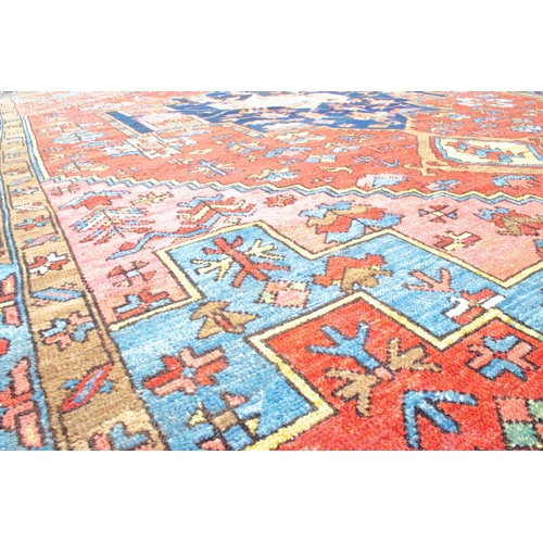 354 - ANTIQUE WOOL HERIZ KARAJA CARPET, 398 X 299 CM Terracotta ground colour has a wonderful harmony with... 