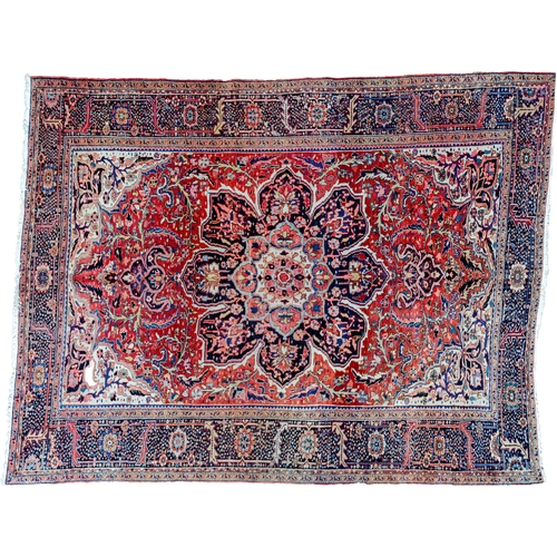 360 - LARGE ANTIQUE HERIZ CARPET, 351 X 250CM  Bold Heriz medallion on a soft red ground with stylish leav... 