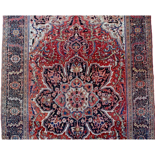 360 - LARGE ANTIQUE HERIZ CARPET, 351 X 250CM  Bold Heriz medallion on a soft red ground with stylish leav... 