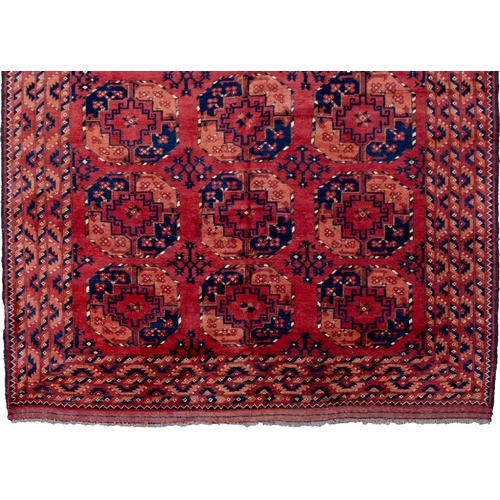 361 - LARGE ANTIQUE ERSARI CARPET, 300 X 198CM Three rows of large octagonal Guls are on a soft red ground... 