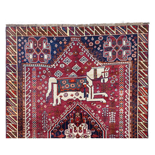 366 - VINTAGE QASHQAI RUG, 234 X 153CM  Charming vintage Qashqai rug featuring two large horses with beaut... 