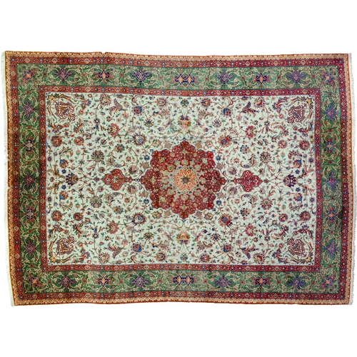 367 - A VINTAGE PART SILK TABRIZ CARPET, 390 X 288CM  A pistachio green ground is decorated with a medalli... 