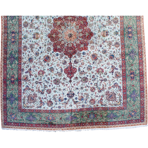 367 - A VINTAGE PART SILK TABRIZ CARPET, 390 X 288CM  A pistachio green ground is decorated with a medalli... 