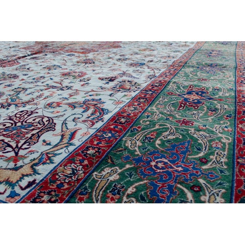 367 - A VINTAGE PART SILK TABRIZ CARPET, 390 X 288CM  A pistachio green ground is decorated with a medalli... 