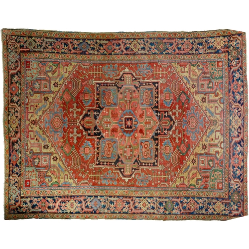 369 - A LARGE ANTIQUE BAKHSHAYSH CARPET, 380 X 294CM  With rich red ground colour contains a large red med... 