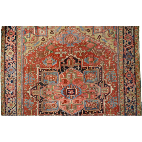 369 - A LARGE ANTIQUE BAKHSHAYSH CARPET, 380 X 294CM  With rich red ground colour contains a large red med... 