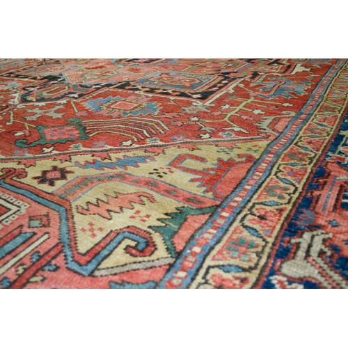 369 - A LARGE ANTIQUE BAKHSHAYSH CARPET, 380 X 294CM  With rich red ground colour contains a large red med... 