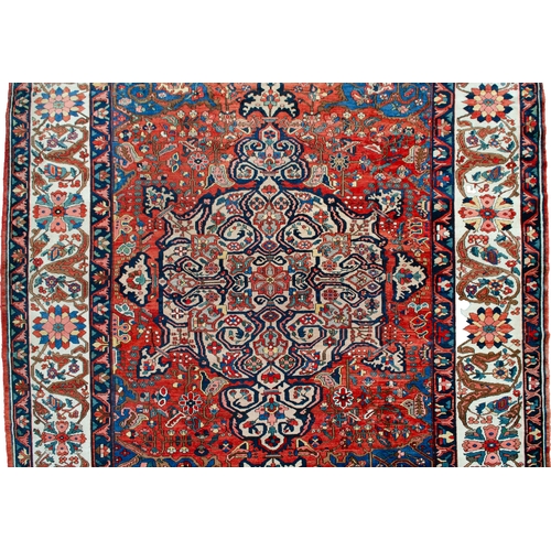 370 - A LARGE ANTIQUE BAKHTIAR CARPET, 420 X 326CM A striking Bakhtiar medallion on a rich terracotta back... 