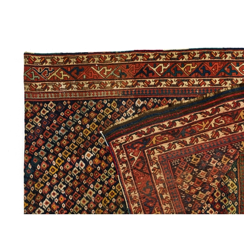 373 - A LARGE TRIBLE CAUCASIAN WOOL CARPET A LARGE TRIBLE CAUCASIAN WOOL CARPET