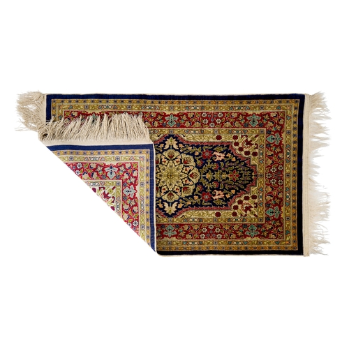 378 - A TURKISH HEREKE SILK RUG A TURKISH HEREKE SILK RUG 
 
85x53cm