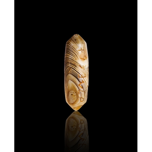 64 - A SARDONYX AGATE IN THE FORM OF A BEAD, INSCRIBED WITH PHONETIC LETTERS, 600 B.C. A SARDONYX AGATE I... 