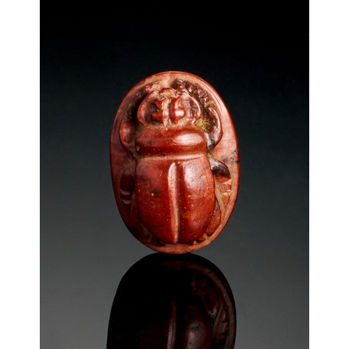 65 - A RED JASPER EGYPTIAN SCARAB, 26TH DYNASTY A RED JASPER EGYPTIAN SCARAB, 26TH DYNASTY 
 
L: 2.2cm&nb... 