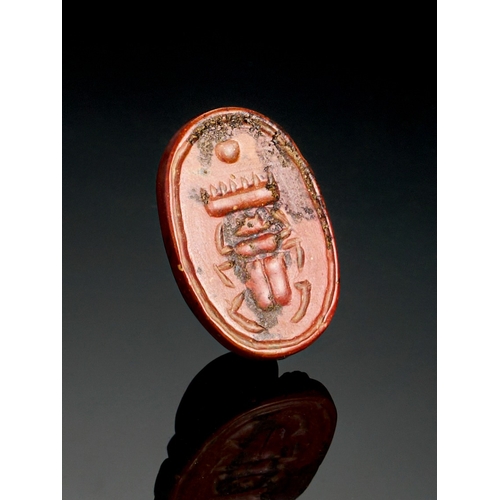 65 - A RED JASPER EGYPTIAN SCARAB, 26TH DYNASTY A RED JASPER EGYPTIAN SCARAB, 26TH DYNASTY 
 
L: 2.2cm&nb... 