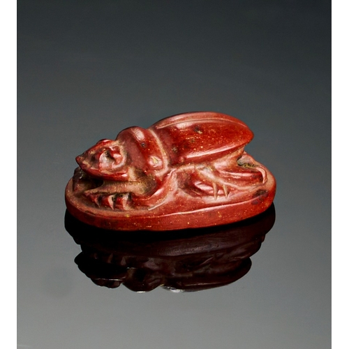 65 - A RED JASPER EGYPTIAN SCARAB, 26TH DYNASTY A RED JASPER EGYPTIAN SCARAB, 26TH DYNASTY 
 
L: 2.2cm&nb... 