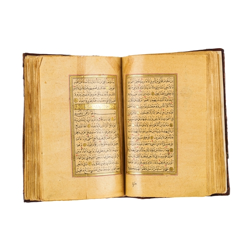 89 - AN ILLUMINTAED OTTOMAN QURAN SIGNED YAHYA HELMY AND DATED AH 1289/ 1873 A.D. AN ILLUMINTAED OTTOMAN ... 