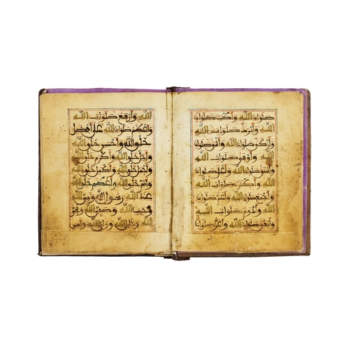 14 - A MOROCCAN PRAYER BOOK, NORTH AFRICA, 18TH - 19TH CENTURYA richly coloured Moroccan Islamic prayer b... 