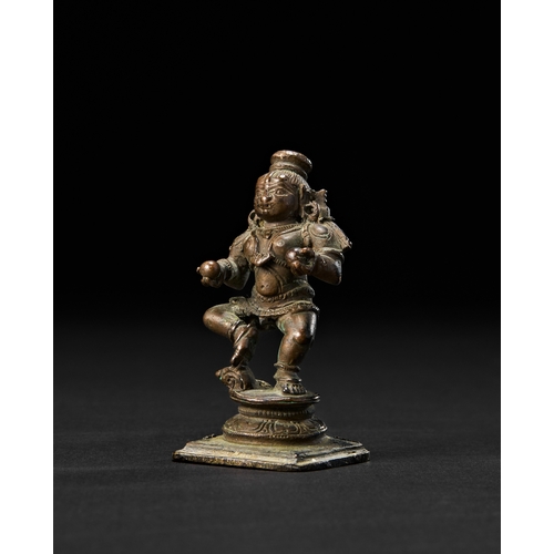 196 - A SOUTH INDIAN BRONZE FIGURE OF KRISHNA THE BUTTER THIEF, 18TH CENTURYDepicted as a lively, childlik... 