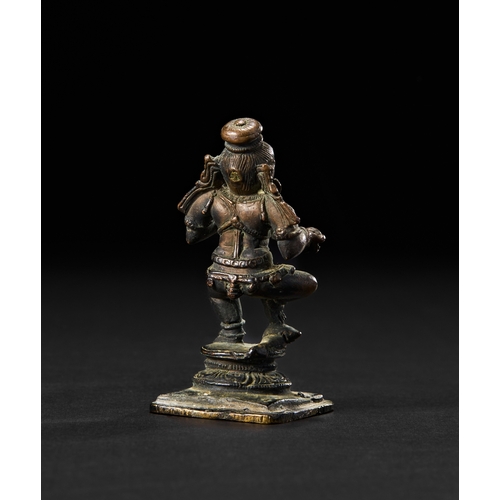 196 - A SOUTH INDIAN BRONZE FIGURE OF KRISHNA THE BUTTER THIEF, 18TH CENTURYDepicted as a lively, childlik... 