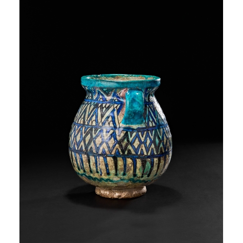 212 - AN OTTOMAN DAMASCUS GLAZED POTTERY TWIN HANDLED VASE, 17TH CENTURYAdorned with a dynamic geometric l... 