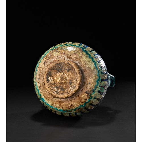212 - AN OTTOMAN DAMASCUS GLAZED POTTERY TWIN HANDLED VASE, 17TH CENTURYAdorned with a dynamic geometric l... 